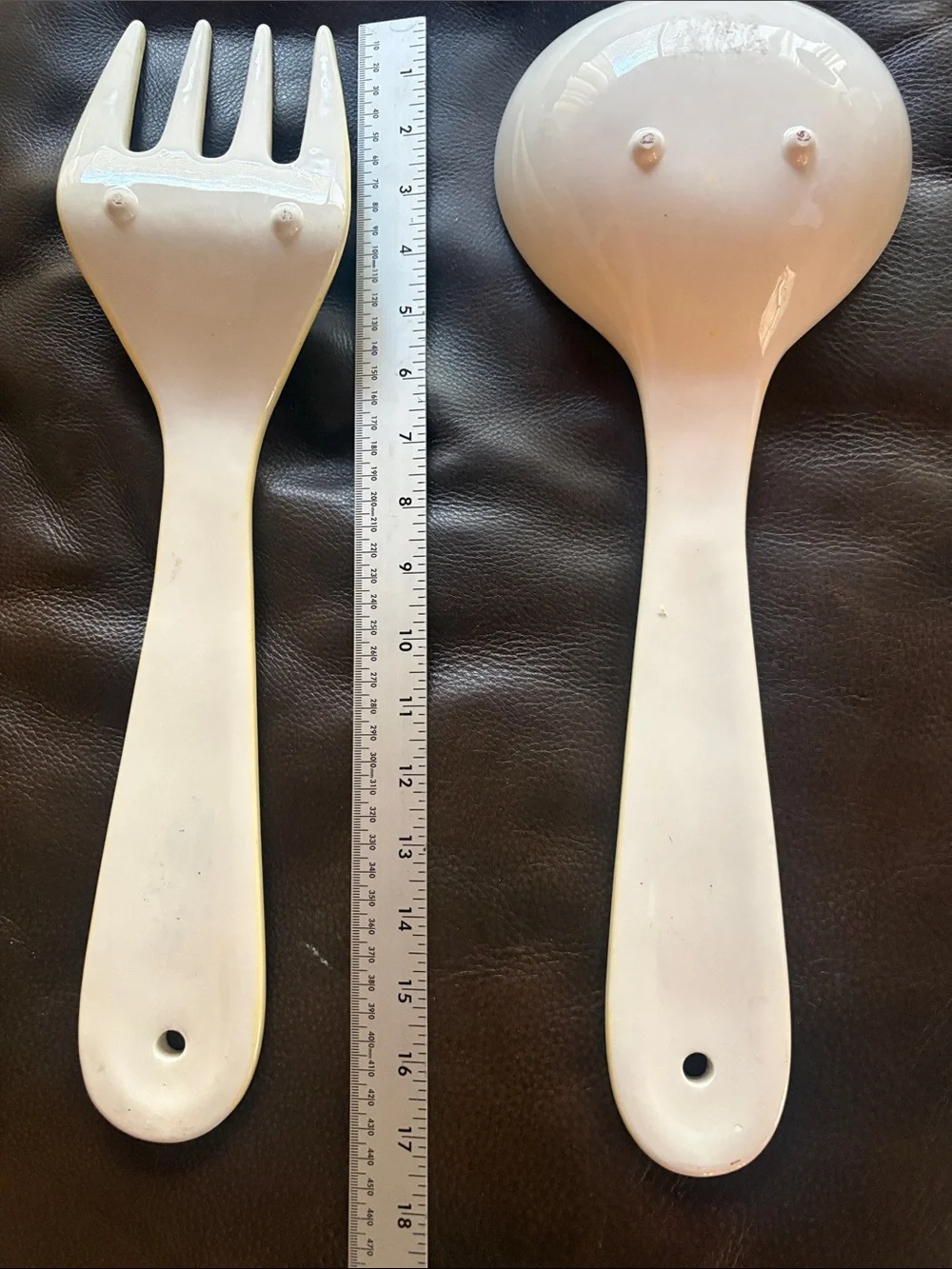 Ceramic Tropical Spoon & Fork Wall Hangings. Light Yellow Background